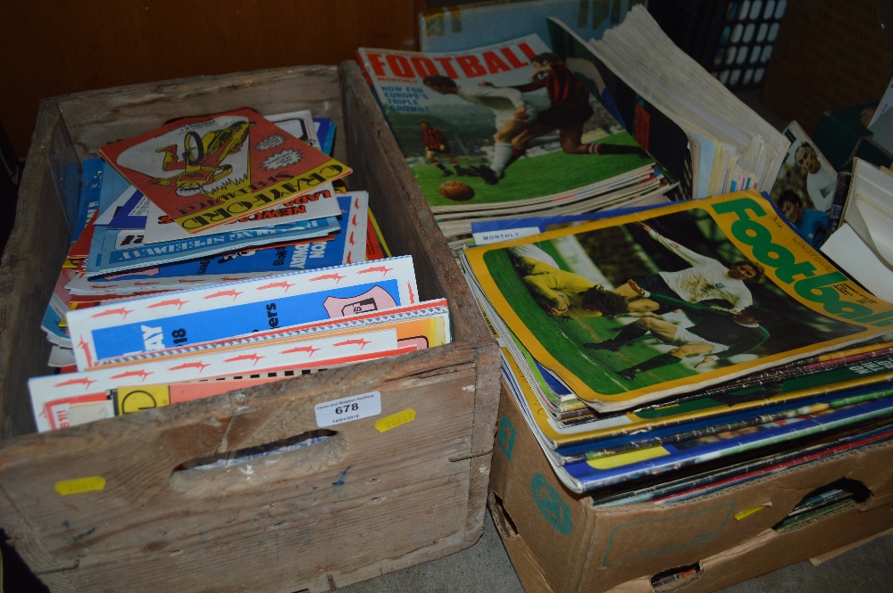 A box of various football programmes together with