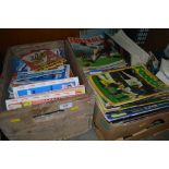 A box of various football programmes together with