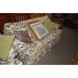 A floral upholstered two seater settee