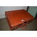 A brown leather suitcase