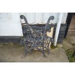 A pair of ornate garden bench ends