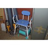 A disability chair and two stools