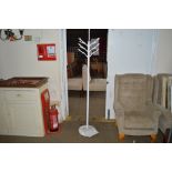 A metal hat and coat stand