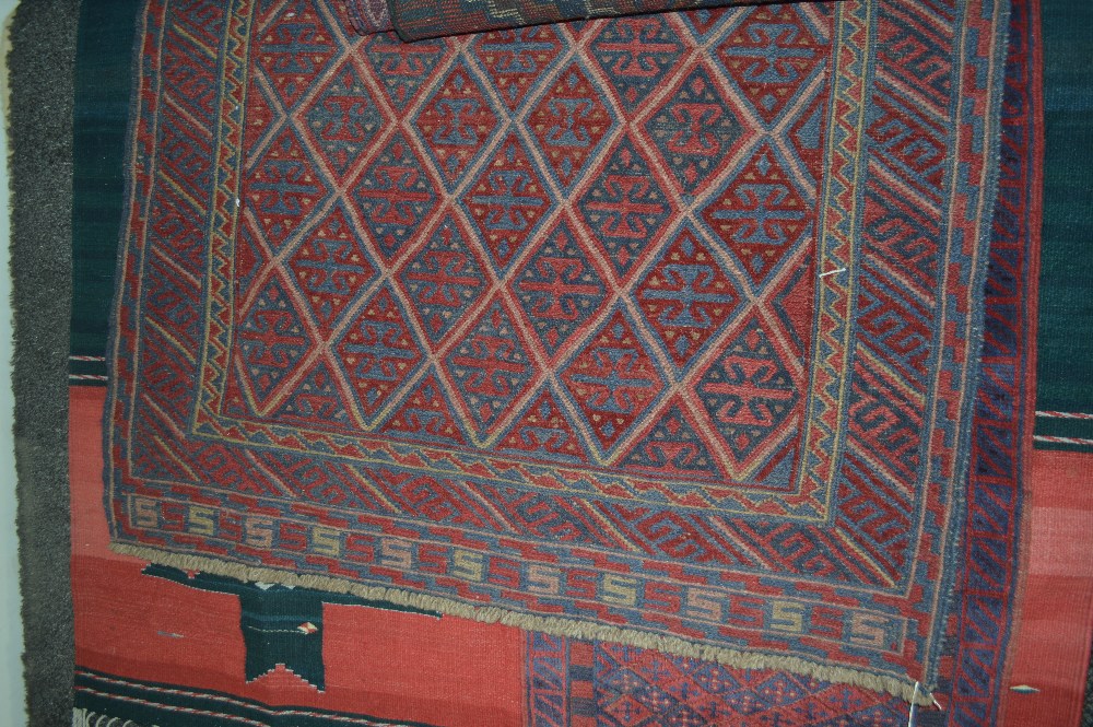 An approx 4" x 3'9" Kazak rug