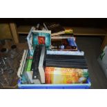 A plastic crate of books