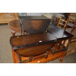 Two drop leaf tables together with a nest of three