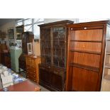 A Georgian style mahogany and glazed bookcase rais