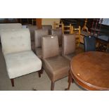 A set of six faux leather upholstered dining chair