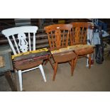 A pair of pine dining chairs and one painted pine