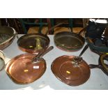 Two copper pans and four copper lids