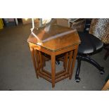 A nest of three hexagonal top occasional tables