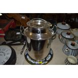 A stainless steel milk churn (24)