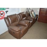 A brown leather three piece suite comprising of a