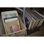 A box of prints together with a box of records