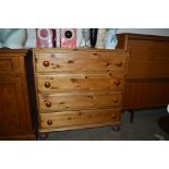 A modern pine chest fitted four long drawers