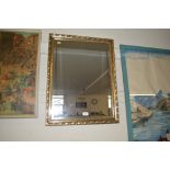 A gilt framed and bevel edged mirror
