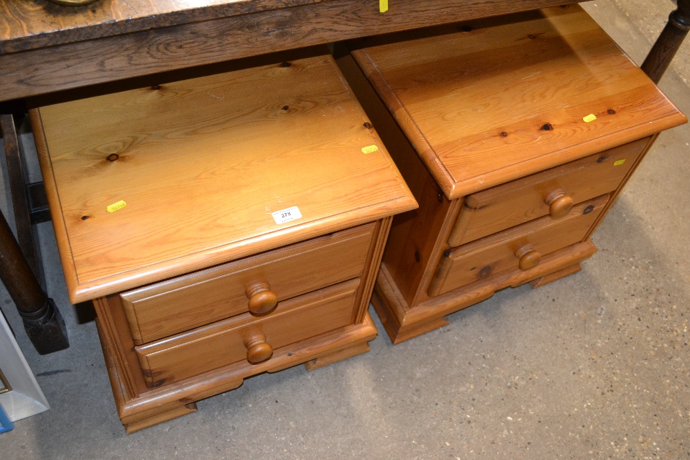 A pair of pine two drawer bedside chests
