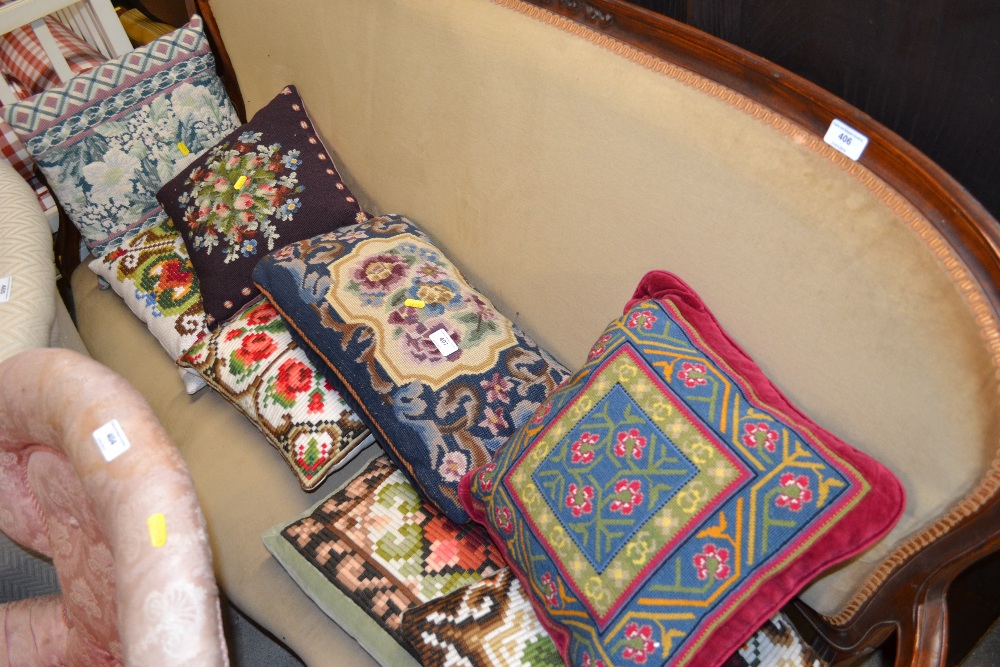 A quantity of needlework cushions