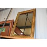 A gilt framed wall mirror