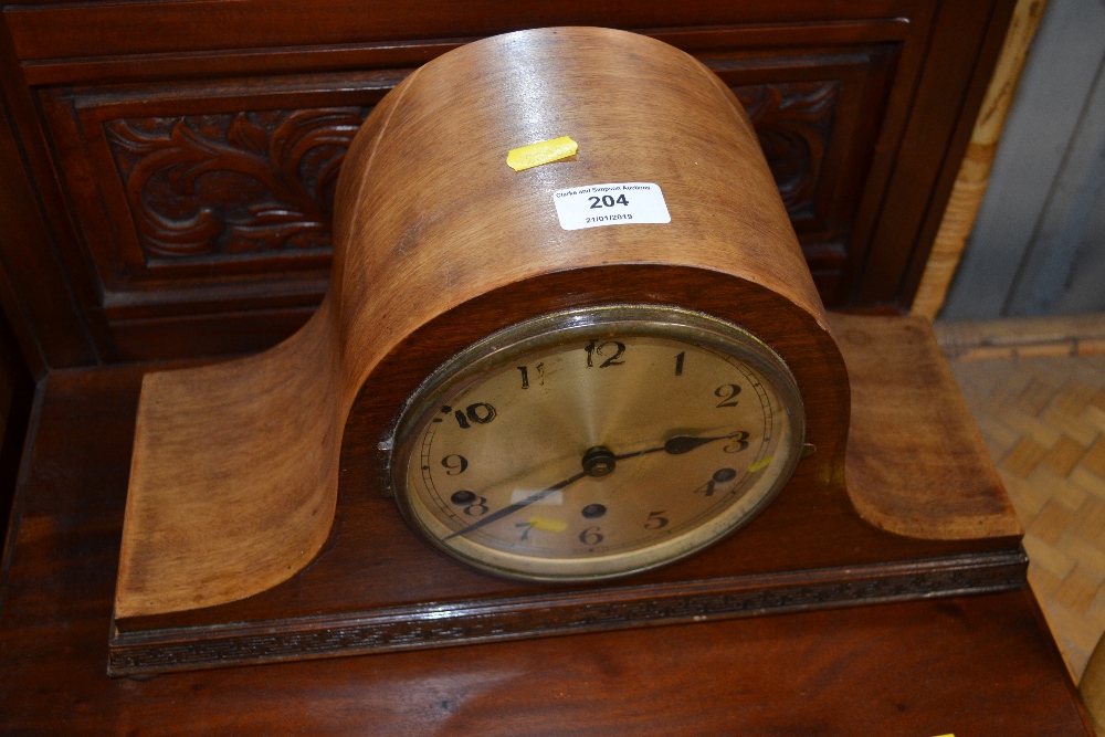 A mahogany cased three hole mantel clock