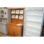 A stripped pine kitchen dresser fitted two drawers