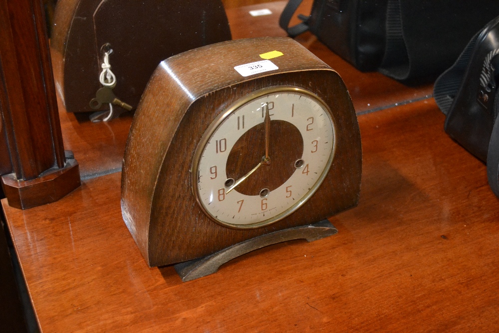 An oak cased three hole Westminster chime clock