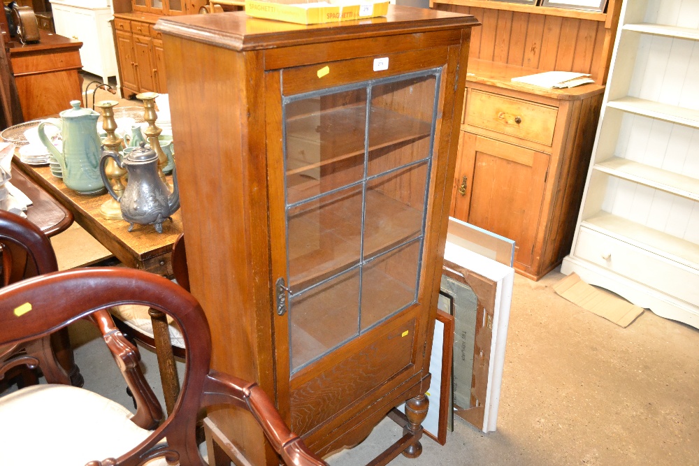 A small oak and leaded glazed display cabinet