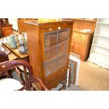 A small oak and leaded glazed display cabinet