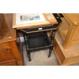 A late Victorian ebonised two tier window table
