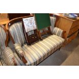 An early 20th Century mahogany striped upholstered