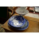 A white glazed and floral decorated pedestal bowl;