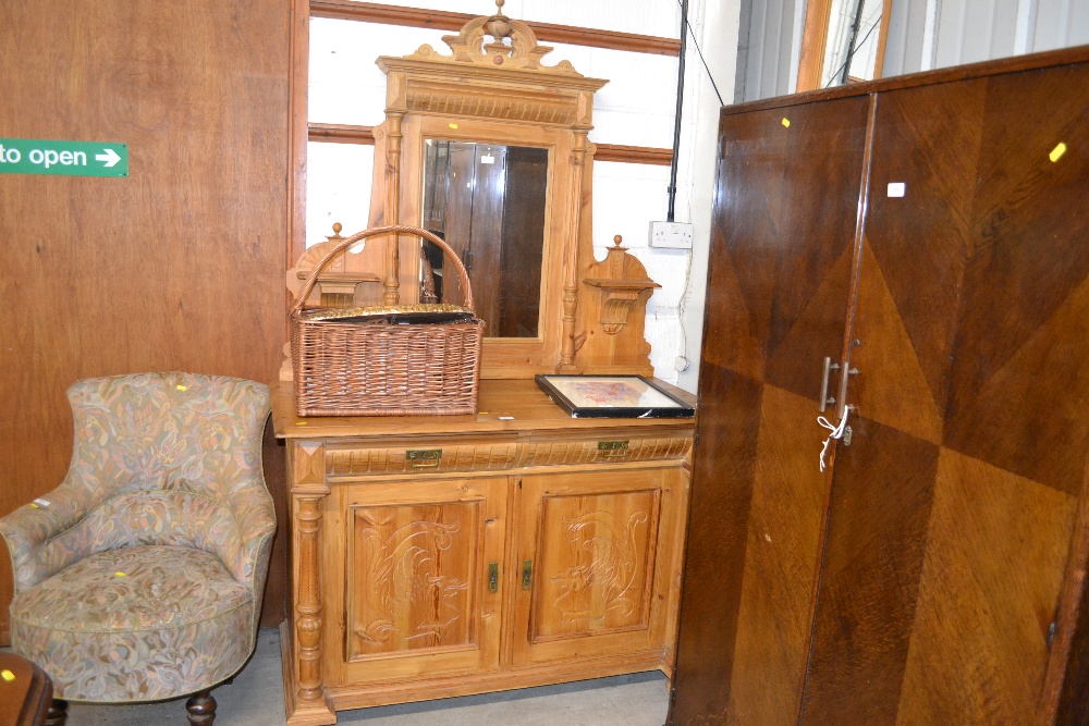 A large stripped pine and mirrored back sideboard