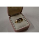 A 9ct gold black spinel and diamond set ring