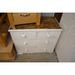 A white painted pine chest fitted two short over t