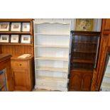 A white painted pine open fronted bookcase