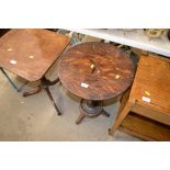 An oak circular topped occasional table inlaid wit