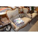 An early 20th Century mahogany shaped back settee