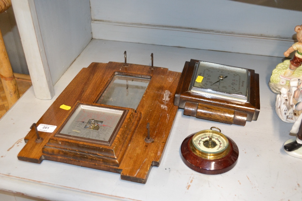 Three various barometers