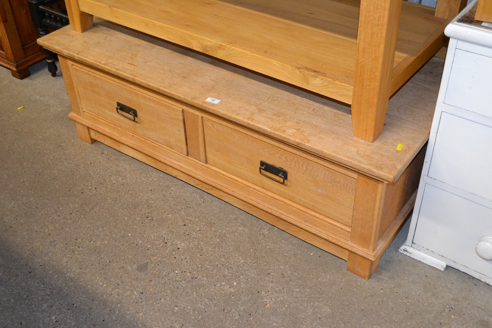 A light oak coffee table fitted two drawers