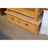 A light oak coffee table fitted two drawers