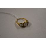 An antique yellow metal, diamond and pearl ring