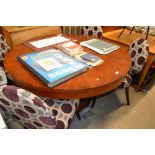 A large oak circular top extending dining table; w