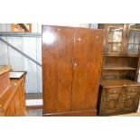 An oak two door compactum wardrobe