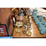 A quantity of various brass candlesticks; a copper