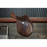 A brown leather saddle