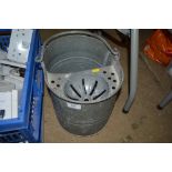 A galvanised mop bucket