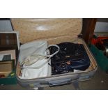 A suitcase of ladies handbags
