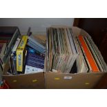 A box of LPs and a box of DVDs and CDs etc