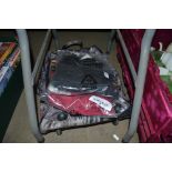 A suitcase and a small quantity of various clothin