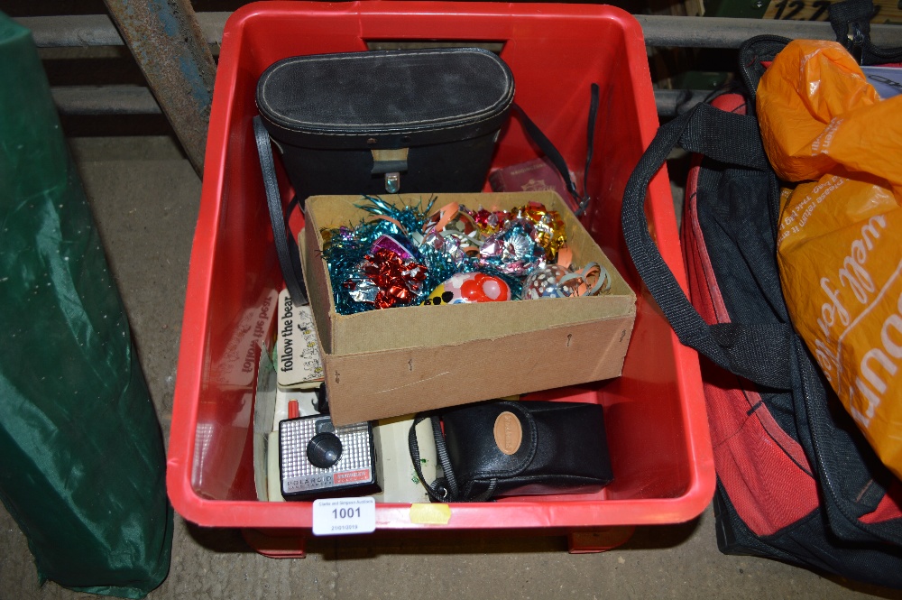 A box containing Christmas decorations; badges; bi